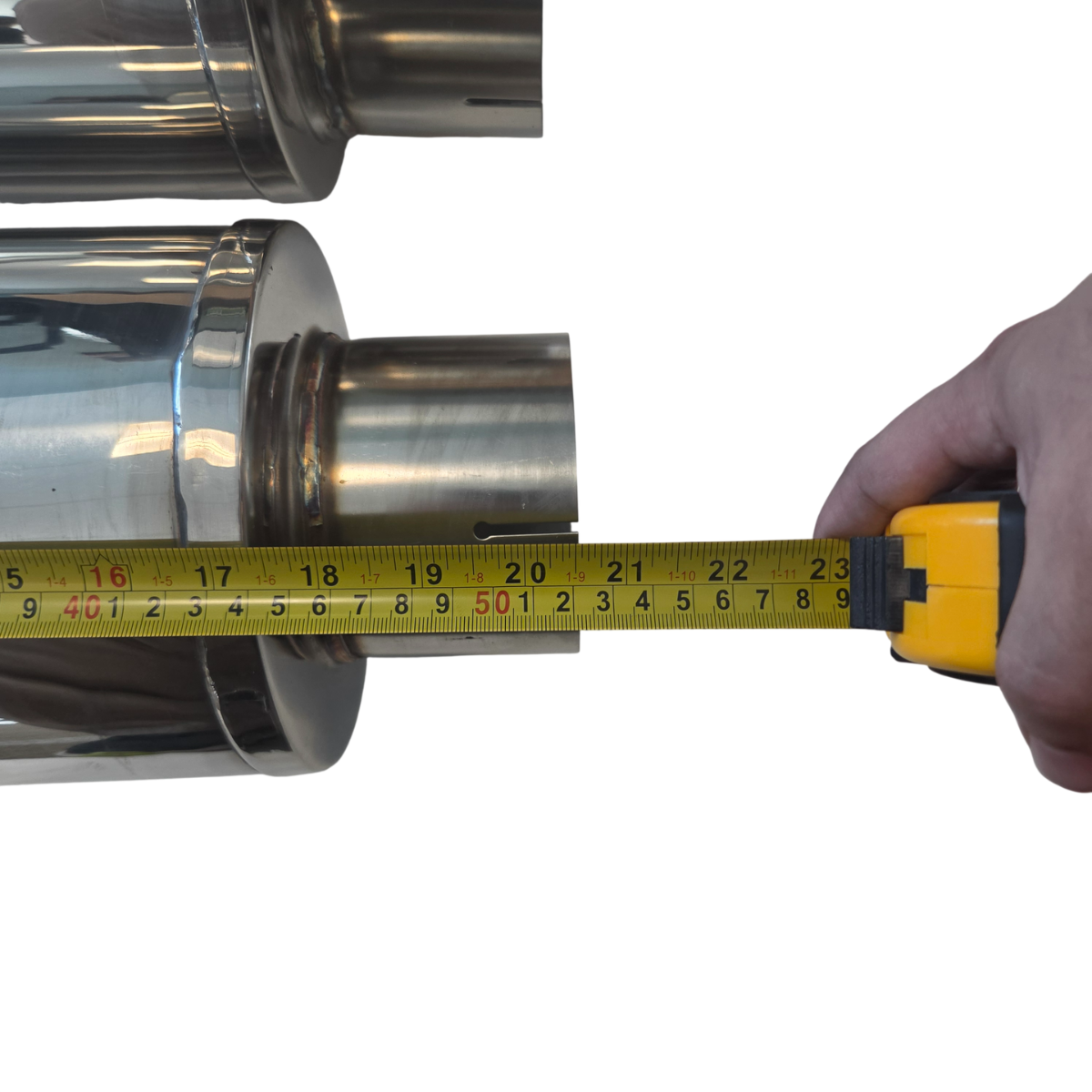 Measuring stainless steel diesel muffler body length with tape measure showing 20.5 inch