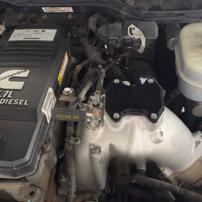 Customer-uploaded photo of a 6.7L Cummins EGR delete kit installed on a Ram diesel engine.